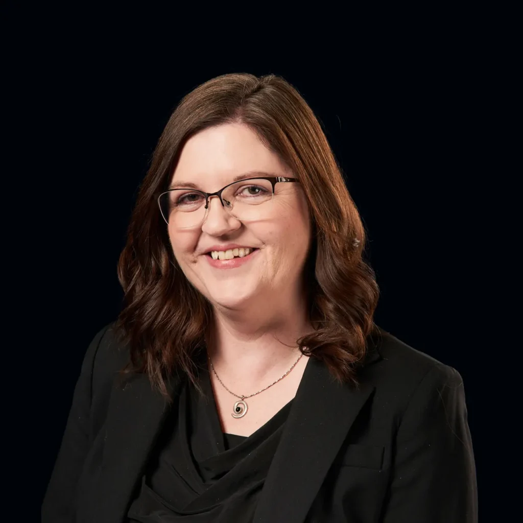 Anita Bell headshot wearing a black blazer