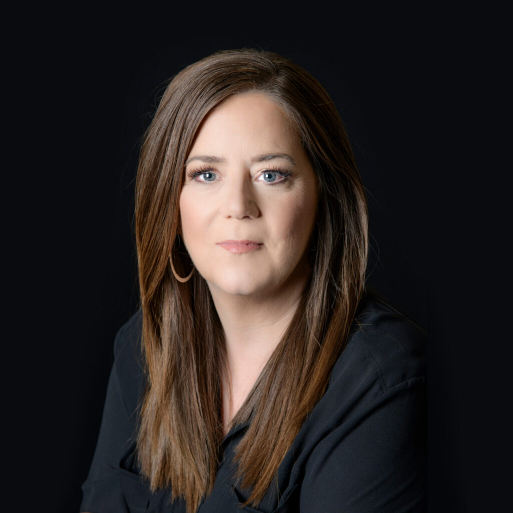 Headshot of Carol Stewart in black blazer