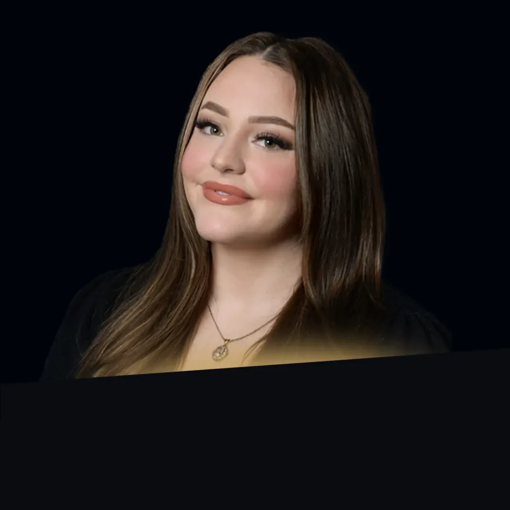Ariana Deitch headshot wearing a black sweater with gold glow at bottom of photo