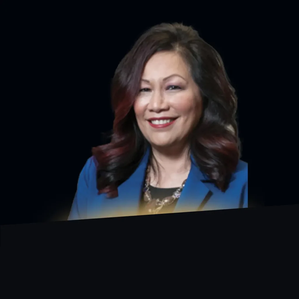 Cecilia Mata headshot wearing dark blue blazer with gold glow at bottom of photo