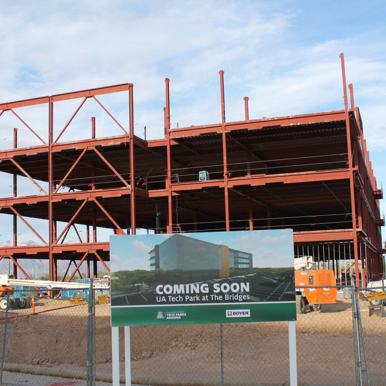 Construction site with a coming soon sign.