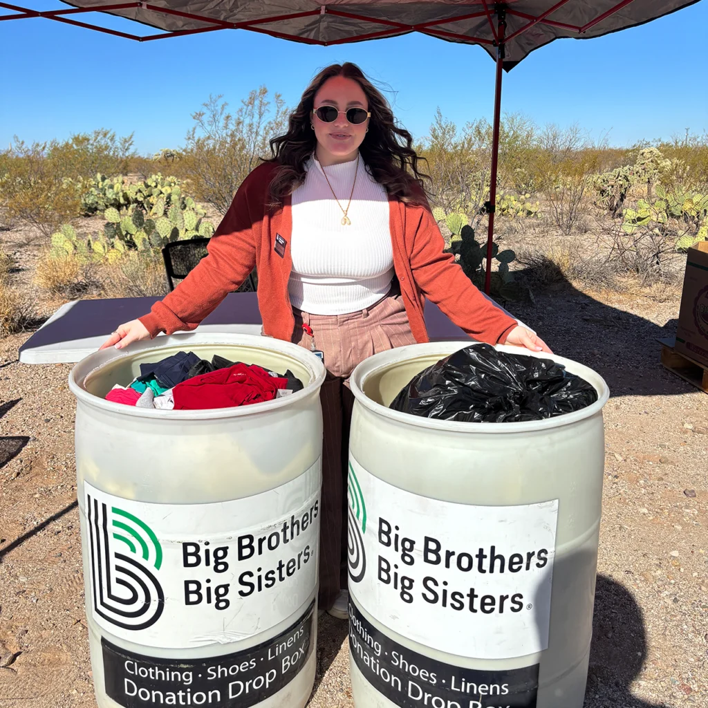 Tech Parks employee next to donation bins