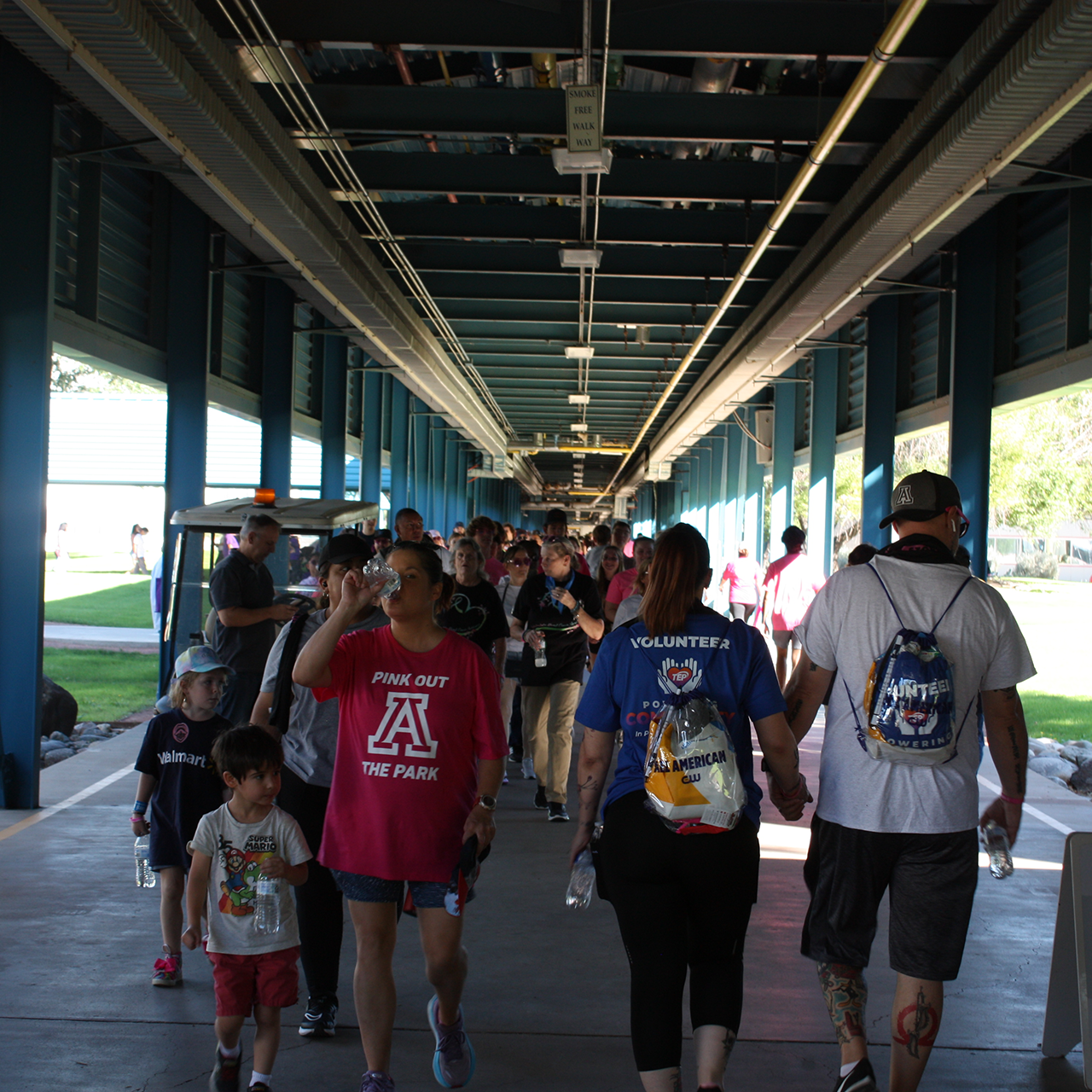 People walking in covered walkway