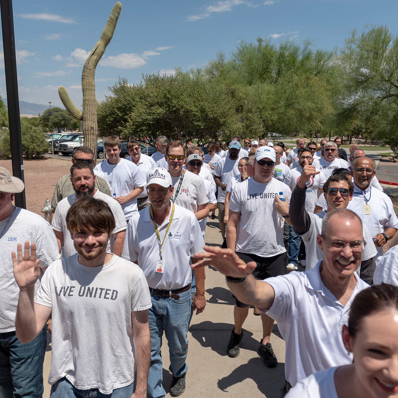IBM employees volunteering in white shirts