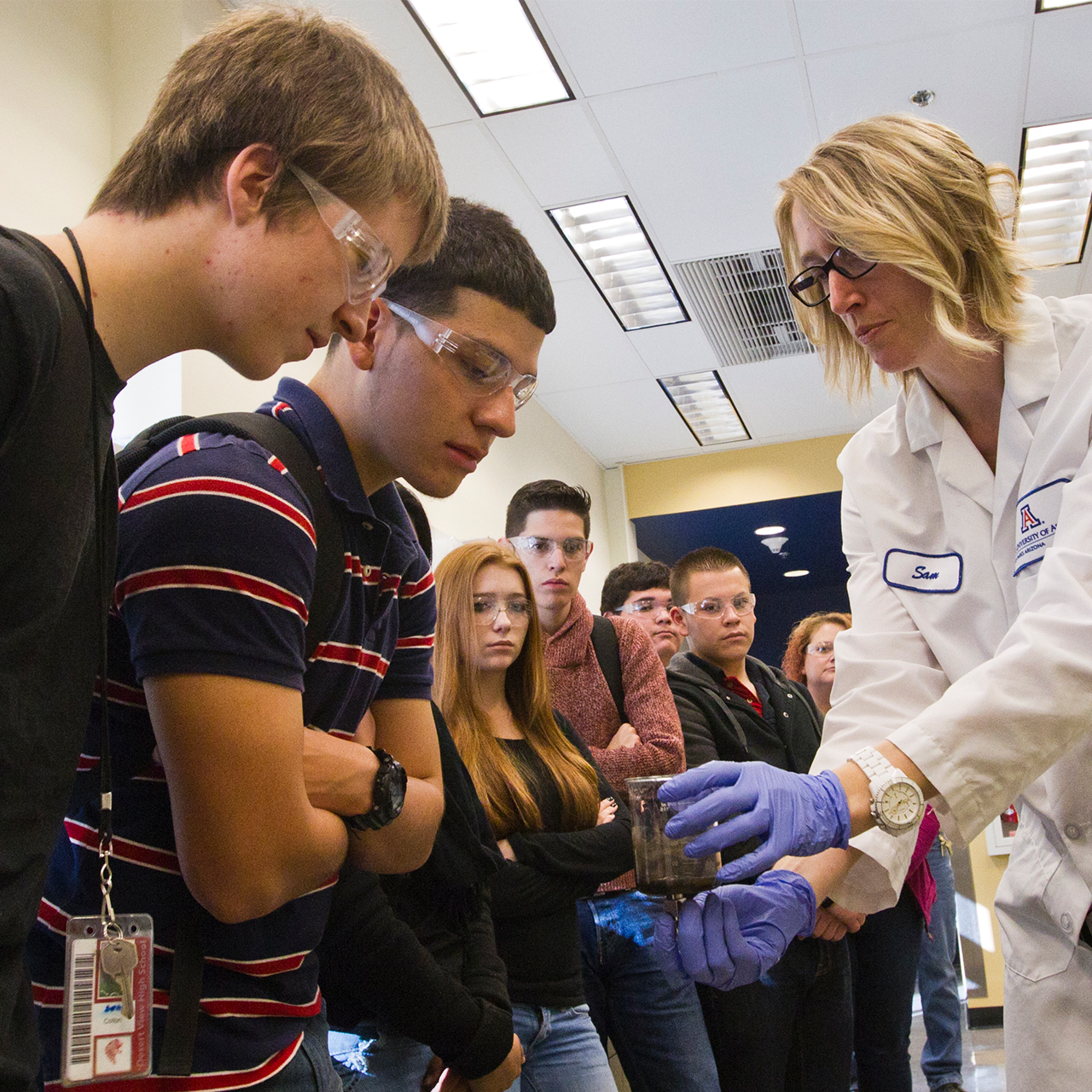 Students learning from a scientist