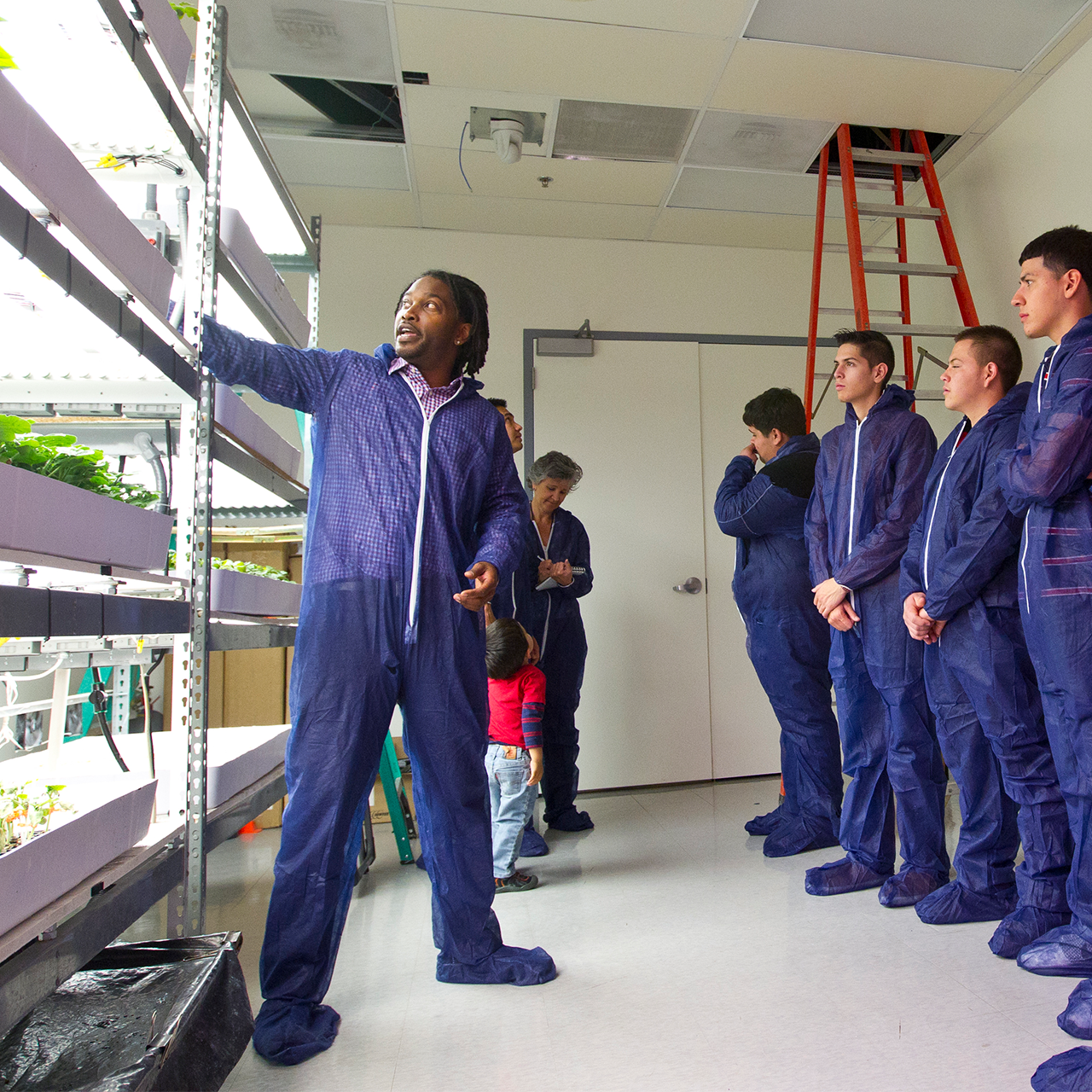 Scientist teaching students
