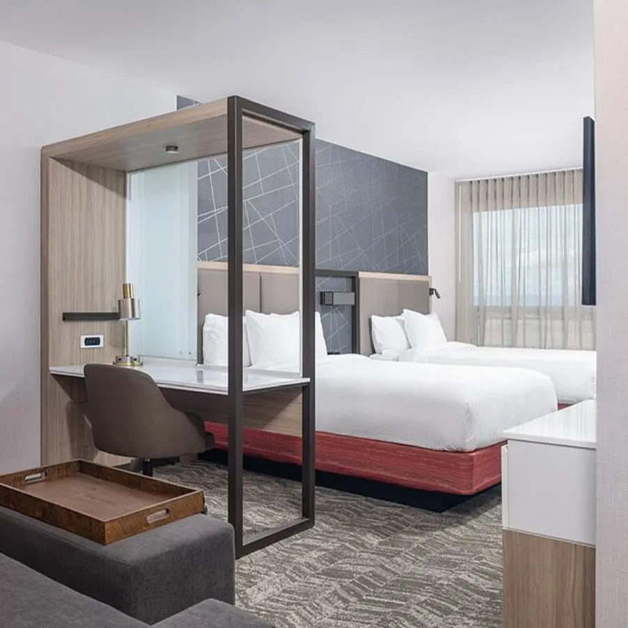 Hotel room with two bed and a desk.