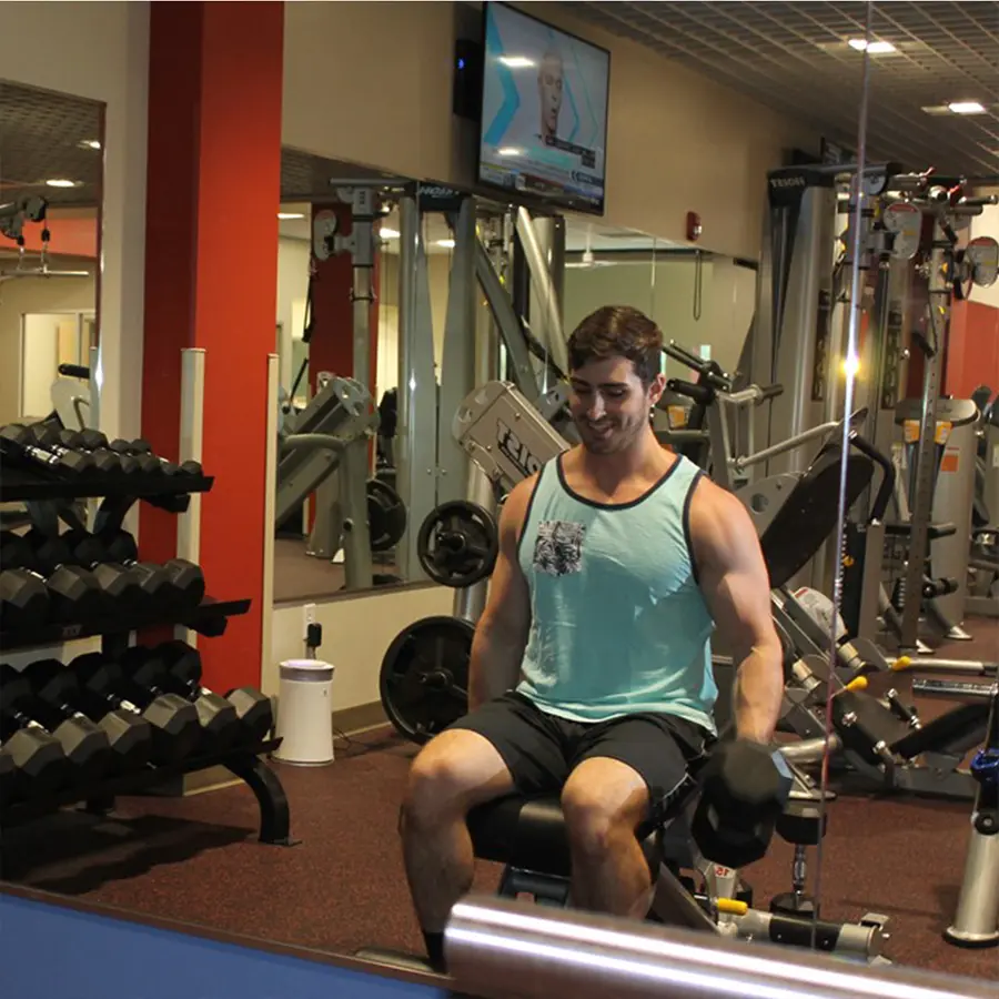 Man working out in mirror.